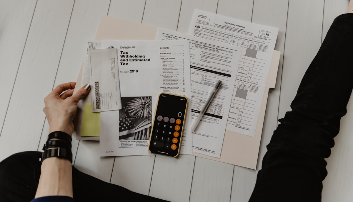 Calculator and utility bill on a kitchen table